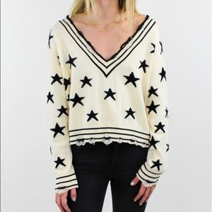 Wild Honey white distressed sweater w black stars